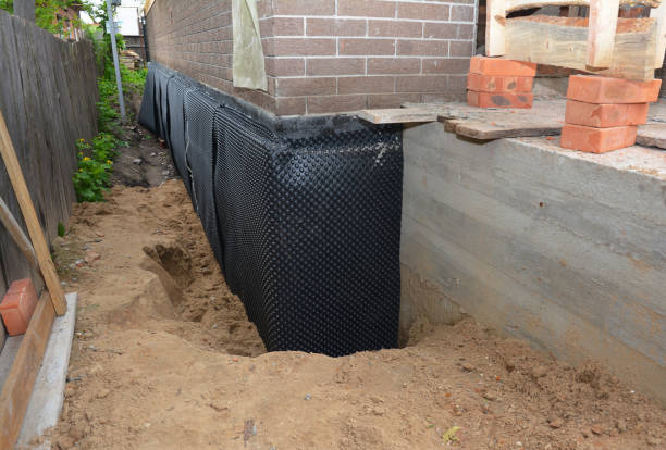 Happy homeowners after waterproofing job in Sycamore